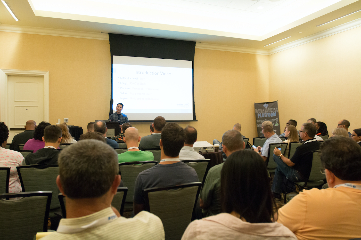 Anthony Tran speaking at Podcast Movement conference